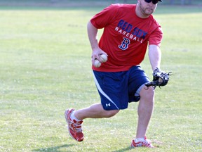 Red Sox starting pitcher Jamie Richmond fields a ball in the outfield on Wednesday during batting practice prior to the team's game at Arnold Anderson Stadium against the Barrie Baycats. (Expositor photo)
