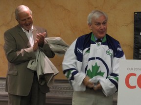Kevin O'Shea (right), an assistant secretary for the Privy Council, dons a Team Cornwall jersey after speaking at the organization's annual general meeting on Thursday as Cornwall Mayor Bob Kilger looks on.
Cheryl Brink staff photo