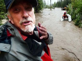 Photojournalist Tom Walker captured imagines of the Cochrane Fire Service water rescue team in action in Bragg Creek June 20. Walker was trapped on the roof of his car with another person from the flash flood.