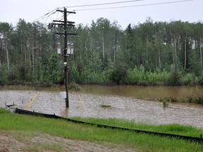 Flooding off side of Highway 63, at the Highway 881 junction near Fort McMurray June 10, 2013. AMANDA RICHARDSON/TODAY STAFF