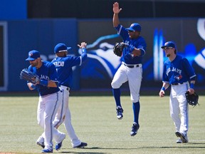 The Blue Jays celebrate following a win in the first half of the season. (Reuters)