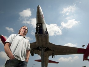 Aircraft mechanic Ian Waite stands in front of a jet at London International Airport in London on Wednesday. With Air Canada Jazz closing the maintenance facility in London, Waite is one of the few moving to their other facility in Halifax to secure his job. CRAIG GLOVER The London Free Press / QMI AGENCY