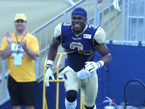 Winnipeg Blue Bombers safety Cauchy Muamba runs onto the field during pre-game introductions before taking on the Montreal Alouettes in CFL action at Investors Group Field in Winnipeg on Thurs., June 27, 2013. KEVIN KING/Winnipeg Sun/QMI Agency