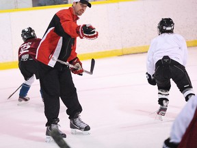 Former Peterborough Petes defenceman Geordie Kinnear directs players through a drill during the Tri-County Pros Hockey School in 2012. Simcoe Reformer/QMI Agency file photo
