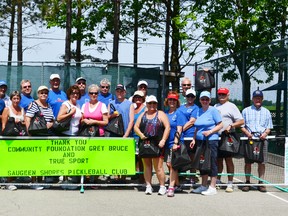 The tournament participants with their prizes and gift bags.