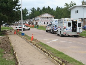 SEAN CHASE   Ambulances sit outside General Lake Public School Friday afternoon as OPP officers search for a suspect in what they have described as a "serious incident."