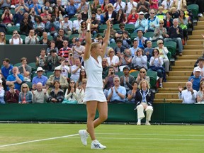 Kaia Kanepi of Estonia celebrates after defeating Angelique Kerber of Germany in their women's singles tennis match at the Wimbledon Tennis Championships, in London June 28, 2013. REUTERS/Toby Melville