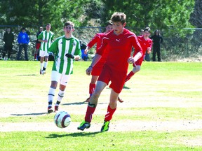 Tyler Caron tries to control the ball before making a run up the middle of the field at a tournament in May. The St. Thomas Aquinas boys soccer team was awarded the OFSAA Sportsmanship Award for their excellent attitude on and off the field at the 2013 Boys 'A' OFSAA in TImmins on June 6-8. 

GRACE PROTOPAPAS/KENORA DAILY MINER AND NEWS