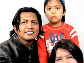 Nerlin Lizbeth Sarmiento, 32, is shown with her husband Florentino Jajoy and her seven-year-old son, Omar. Sarmiento has been charged with first-degree murder in Omar's death.  Photo Supplied