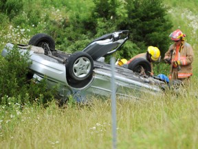 Wyoming firefighters were on scene at the site of a single-vehicle rollover Friday off Highway 402, near the Oil Heritage Road off-ramp. TYLER KULA/ THE OBSERVER/ QMI AGENCY