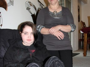 Reanna Pyne, 16, is living with a terminal brain stem tumour. She's pictured here in December, 2012, with her mother Denise D'Eon at their Sarnia home. Hundreds of people sang carols and left gifts at Pyne's home Christmas Eve, an act that continues to buoy the family as they cope with Pyne's grim diagnosis. (BARBARA SIMPSON, The Observer)