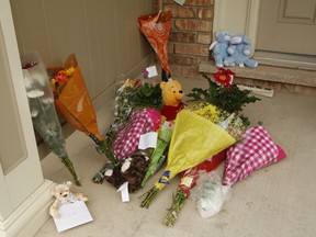 A make-shift memorial of flowers and Teddy bears has sprung up on the front steps of a Milton home where a two-year-old boy died when he was left in the sweltering heat inside of a parked car Wednesday. 
CHRIS DOUCETTE/TORONTO SUN