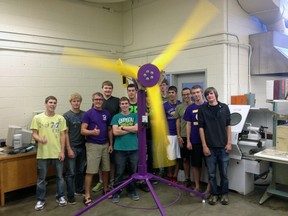 Teacher Chris Underhill, third from left, stands with a group of manufacturing engineering technologies students from East Elgin Secondary School in Aylmer. The class built a working wind turbine from scratch in a single semester. (Ben Forrest, Times-Journal)