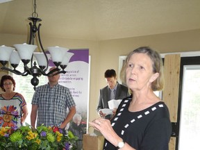 Laura Stricker photo. 
In this file photo, Jean Hanson, a member of the Canadian Mental Health Association board, speaks at an open house held at the CMHA's new supportive residence on Moonlight Avenue in June 2013. Hanson passed away in February after fighting cancer for the second time.