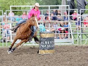 Robin Hammond makes a sharp turn in the barrel racing event during the Ultimate Rodeo Tour in Pain Court on Friday. Proceeds went to support Chatham-Kent Crime Stoppers. TREVOR TERFLOTH trevor.terfloth@sunmedia.ca