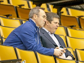David Nonis (right) sitting with fellow Leafs exec Dave Poulin, has a lot of work ahead of him the next few days, beginning with Sunday's entry draft. (Michael Peake, Toronto Sun)