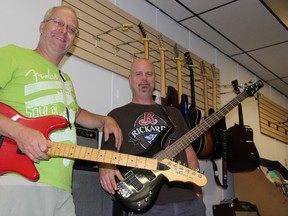 Steve Dumont of Playfair Music and Greg McCabe practice for the upcoming Lambton Woodstock event. The two will join other local musicians to perform a number of classic rock hits performed at the original Woodstock.
LIZ BERNIER/THE OBSERVER/QMI AGENCY