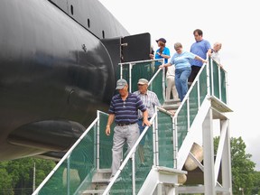 A group of visitors from St. Thomas, Ontario disembark from the HMCS Ojibwa Saturday morning after completing a one hour inside tour of the Cold-War era submarine. Ojibwa officially opened for public (inside) tours this weekend, including Canada Day. For more information or to book a tour, call (519) 633-7641 or visit www.projectojibwa.ca

KRISTINE JEAN/TILLSONBURG NEWS/QMI AGENCY