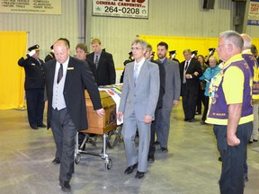 Pallbearers carry the casket of Westport Mayor Bill Thake at the late politician's funeral on June 29 (LESLIE WALKER/The Recorder and Times).