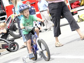 Kayleb Kennedy, 3, was one of many children who participated in a bike rodeo during the annual "We Believe in Dresden Day" outside of St. Andrews Presbyterian Church on Saturday June 29. The rodeo was held to help instill bike safety at a young age for the kids who participated. KIRK DICKINSON/FOR CHATHAM DAILY NEWS/ QMI AGENCY