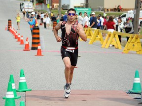 North Bay's Marc Denommee crosses the finish line for his first-ever overall triathlon title. The 38-year-old completed the Noreen Yeates Triathlon in one hour, 43.28 seconds.