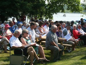 Members of the congregation at the Interdenominational Church Service sing a hymn at Beatty Park. The service took place outside in the sun on Sunday, June 30. 
GRACE PROTOPAPAS/KENORA DAILY MINER AND NEWS