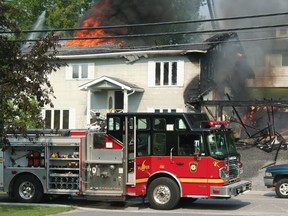 Flames and thick smoke encase a home on Robertson St. on Sunday, June 30. The fire started in the garage of the house some time before 5:00 pm although the cause has yet to be determined.
GRACE PROTOPAPAS/KENORA DAILY MINER AND NEWS