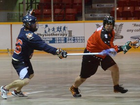 The Owen Sound Quantum Properties NorthStars Bryan Kazarian eludes a check from Brooklin's Brett Shaw in the Merchants 10-5 win on Sunday in Ontario Lacrosse Association Senior B League action.