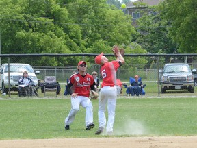 Wiarton shortstop Charlie Malson races to make an over-the-shoulder catch as centrefielder Ben Davis comes in to help in the RedDevils 9-8 win over the Napanee Express on Sunday at the Ontario Amateur Softball Association junior men's eliminations at Duncan McLellan Park.