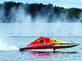 Steve Armstrong, No. 11, speeds up after turning a corner in his first race Sunday morning in the St. Lawrence River during the hydroplane racing event. (THOMAS LEE/The Recorder and Times)