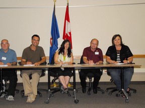 Representatives of each municipality in the Peace Country region were on hand last Thursday for the signing of the official Grande Prairie Regional Emergency Partnership agreement. Present for the signing were: Town of Wembley Mayor Chris Turnmire, from left, City of Grande Prairie Mayor Bill Given, Beaverlodge Mayor Leona Hanson, Town of Sexsmith Mayor Claude Lagace and County Reeve Leanne Beaupre. (Jocelyn Turner/Daily Herald-tribune)