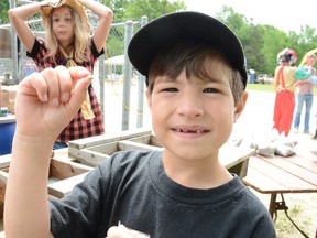 Lincoln McNevan, 8, of the Eugenia area holds up a gold nugget he found while panning for gems at the Eugenia Gold Rush Days on Saturday. By finding the nugget, McNevan took home one of two $25 prizes. There was also a grand prize of $50. (Rob Gowan The Sun Times)