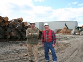 John Kapel Jr., left, and his dad John Sr., operators of Little John Enterprises sawmill, say delays in getting building approvals is hindering development in Timmins. They said frustration has reached a point where some developers are choosing to proceed with building projects rather than wait.