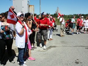 The 18th-annual Canada Day Walk was afoot Monday as close to 50 people, led by organizer Karl Habla and Mayor Tom Laughren, took a stroke from city hall to Schumacher to display their true Canadian spirit.