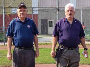 Twin brothers Dave, left, and Joe Boyle, at Megaffin Park, have been umpiring local baseball games for more than 30 years. (Sam Koebrich/For The Whig-Standard)
