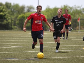 Kingston FC defender Rory Kennedy takes the ball down the field during a Canadian Soccer League match against the St. Catharines Roma Wolves at Queen’s University’s west campus Sunday. KIngston FC won 5-1 to improve its record to 7-2 this season. (Danielle VandenBrink/The Whig-Standard)