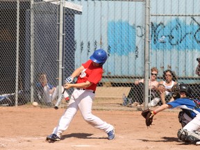 Joey Whelan of the Peewee AAA Oil Giants hits a single in his team’s 14-13 win over the Calgary Cubs 
on Sunday