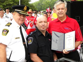 Quinte West fire fighter Jason Forth received a special commendation from Fire Chief John Whelan and Mayor John Williams, as the city paid tribute to first responders at Monday's Canada Day celebrations held in Trenton. Forth is battling cancer.