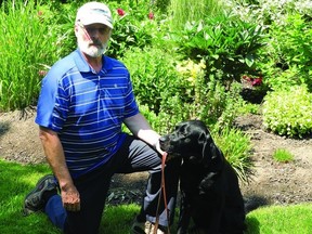 Jim Garrah and his guide-dog-in-training, Civitan the Third, get ready for an outing. Canadian Guide Dogs for the Blind is currently looking for volunteers to provide loving homes for future guide dogs, just like Civitan.            Wayne Lowrie - Gananoque Reporter