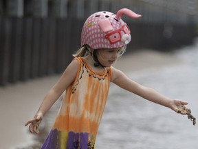 Four-year-old Colbie Rowswell plays on the small beach on the St. Marys River in front of Clergue Park. She was out with her grandmother Kim Kelly. Colbie commented that the water was as cool as an ice cube. She is also the granddaughter of the late Mayor John Rowswell.