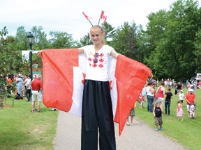 RYAN PAULSEN       Deena Fremont towers above her fellow Canada Day party goers at Petawawa’s Catwalk beach on Monday.