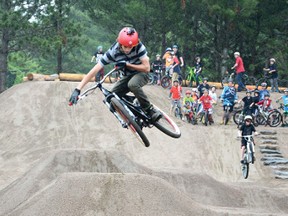 RYAN PAULSEN       Fourteen-year-old Curtis Brennan helps break in the big jumps at Petawawa’s new Civic Centre Bike Park on Saturday, June 29, after the gates were opened for the first time at a grand opening ceremony.