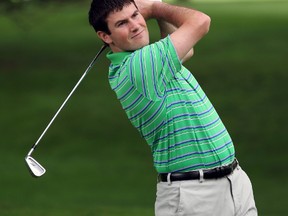 Graham Hill watches his approach shot on the fourth hole during the Sarnia Golf and Country Club Men's Invitational Tournament this weekend. Hill shot a 9-under 135 over the 36-hole tournament to capture the title for the second year in a row, beating Heath McCormick and Eric Pattenaude by eight strokes. (PAUL OWEN, The Observer)