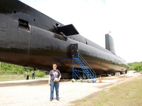 Melissa Raven, director of communications for Project Ojibwa, stands outside the HMCS Ojibwa submarine at Port Burwell in this file photo. (Ben Forrest, Times-Journal)