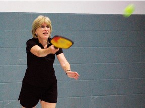 Jan Nicholson of Port Stanley serves in a game of pickleball on Tuesday, July 2, 2013 at the Timken Centre in St. Thomas. (Ben Forrest, Times-Journal)