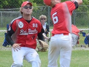 Wiarton shortstop Charlie Malson races to make an over-the-shoulder catch as centrefielder Ben Davis comes in to help during the Red Devils' 9-8 win over the Napanee Express on Sunday at the Ontario Amateur Softball Association junior men's eliminations in Owen Sound. (QMI Agency)