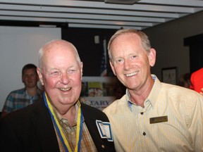 Rotarian Blair Harrison, left, is presented with a Paul Harris Fellowship Award from fellow Rotarian Ross Gowan of the Rotary Club of Norfolk Sunrise during a ceremony held June 25. Harrison has been an active volunteer in the community.