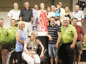 Walton community members involved in hosting the International Plowing Match in Huron County in 2017 posed with an ice sculpture celebrating the news of the host farms. They include from left in the back, Lorne Glanville, Ken Dalton, Joe Ryan, Anneleis Ringgenberg, Peggy Sloan, Jack Ryan, Owen Ryan, Steven Ryan, Darlene Embrey and Albrecht Ringgenberg and in the front, Brian McGavin, Jeff McGavin, Brenda Dalton, Jeanne Kirkby, Ben Driscoll, Graeme Craig and Wayne Cantelon.