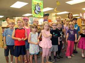 Dozens of kids from across Brant County sign up for the TD Summer Reading Club at the Paris branch of the County of Brant Library on Friday, June 28, 2013. Debbie Demarest of the TD Canada Trust Paris branch joined the children to cut the ribbon and kick off the program. MICHAEL PEELING/The Paris Star/QMI Agency