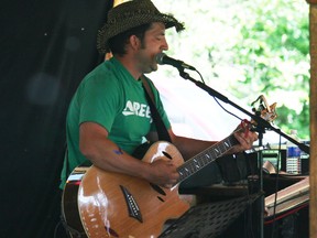 Myles Bean, a carpenter by day, performs for the crowd at the Many Islands Music Festival. (Chris Eakin/Fairview Post)